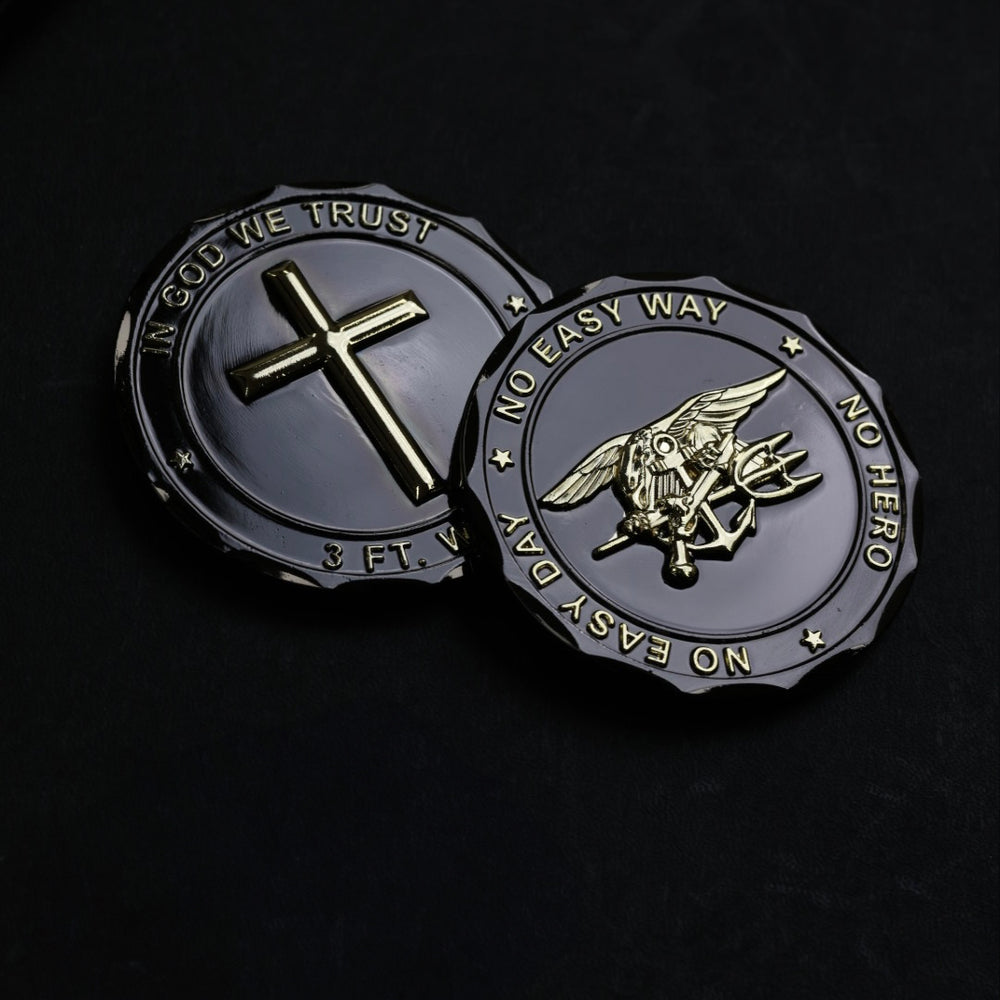 Two military-style challenge coins on a black background