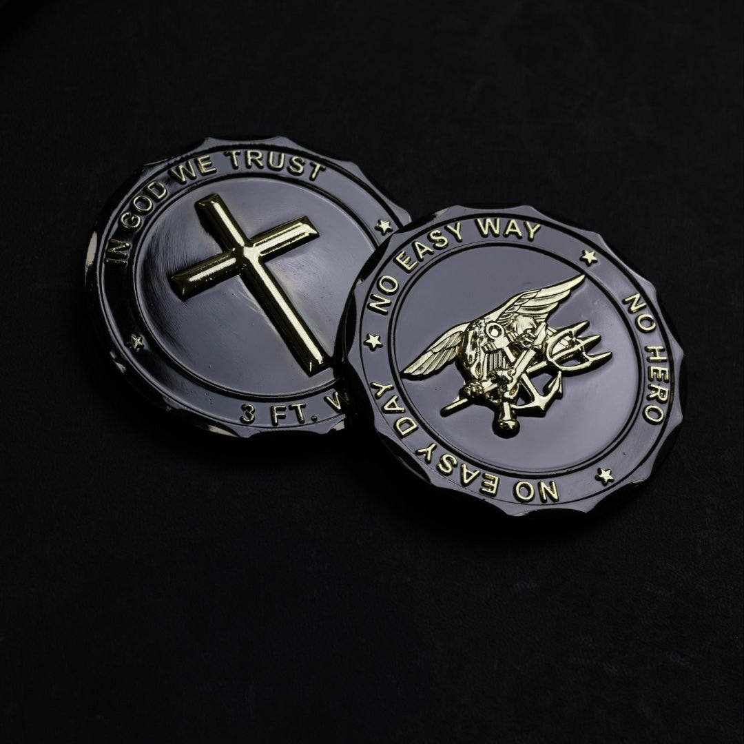 Two military-style challenge coins on a black background