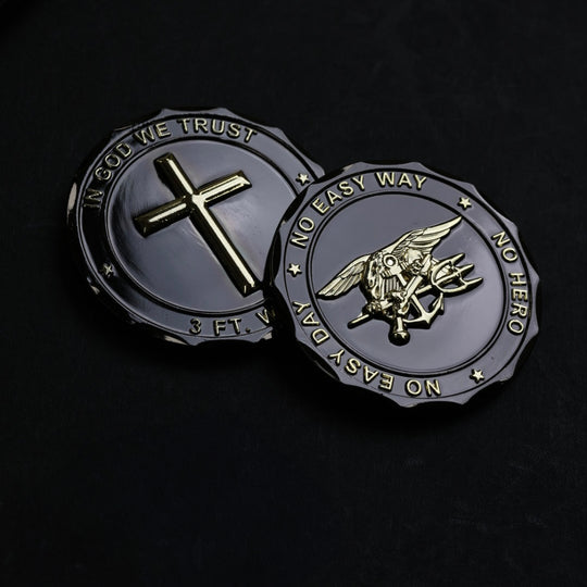 Two military-style challenge coins on a black background